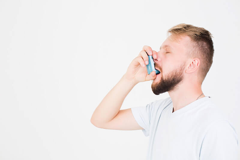 man using inhaler