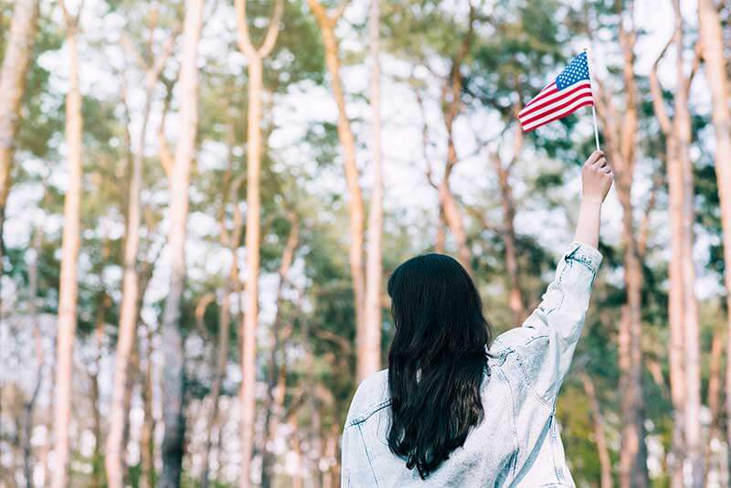 refugee with US flag